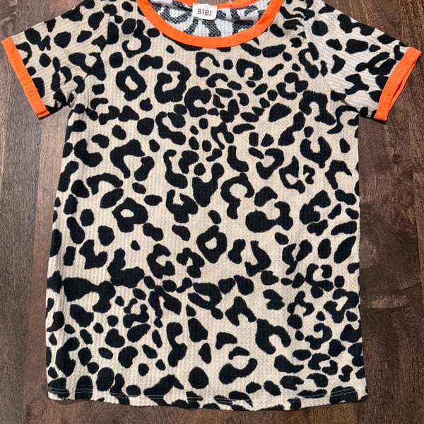 Bibi Chic Women’s animal print waffle t-shirt with neon orange trim.