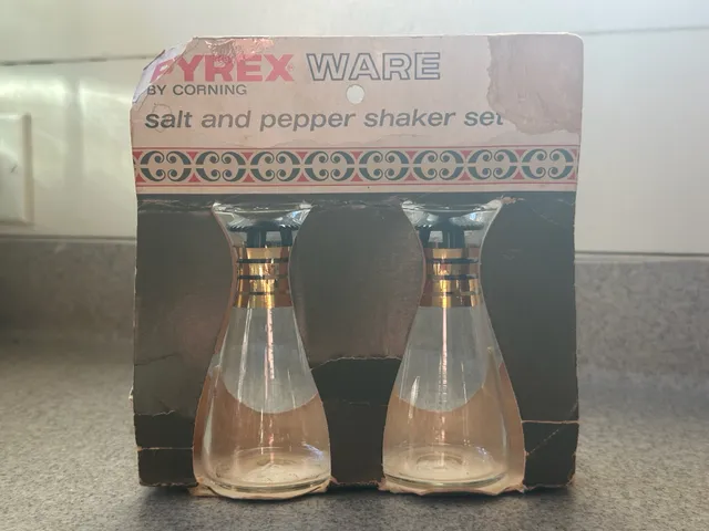 Pyrex Salt And Pepper Shaker Set Gold Bands, unused in packaging