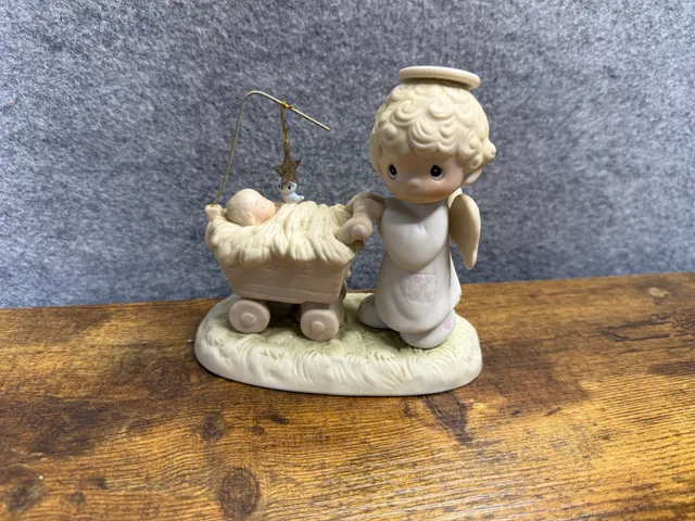 Precious Moments Figurine Angel With Baby In Manger Nativity