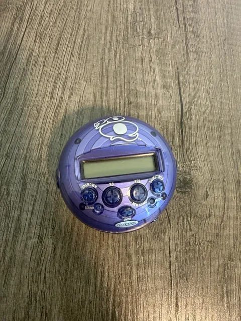 Radica 20Q Handheld Electronic Game Purple Translucent