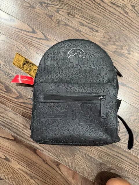Sprayground Black Debossed Graffiti Backpack
(Limited Edition)
