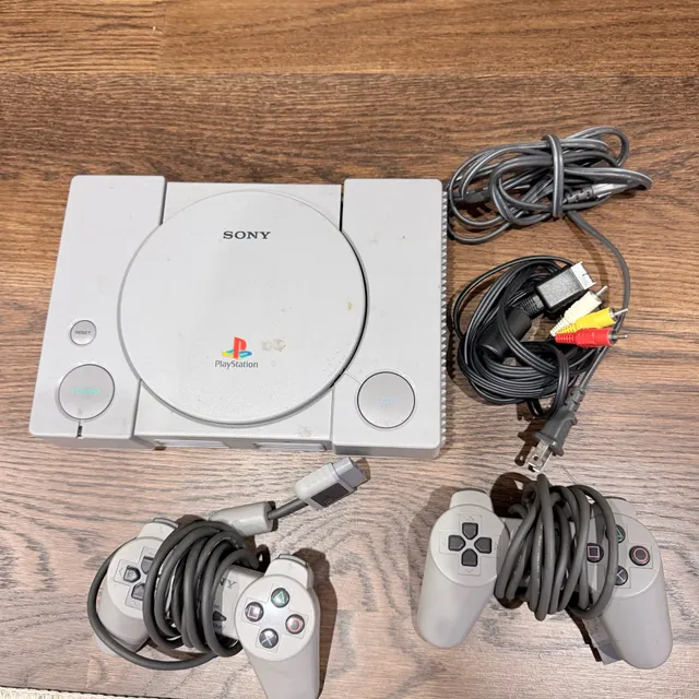 Sony PlayStation 1 Console With Two Controllers And Cables