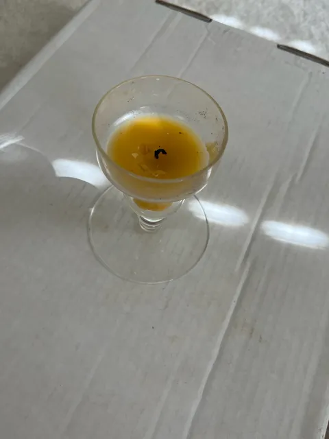 Glass Pedestal Candle Holder with Yellow Wax Candle