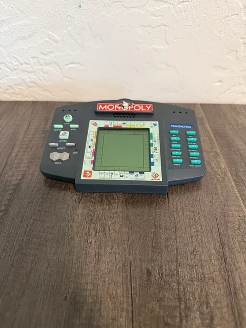 Hasbro Electronic Monopoly Handheld LCD Game Unit 1997