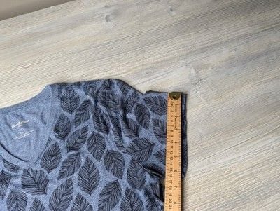 This blue Goodfellow & Co v-neck shirt features a dark leaf pattern. 7