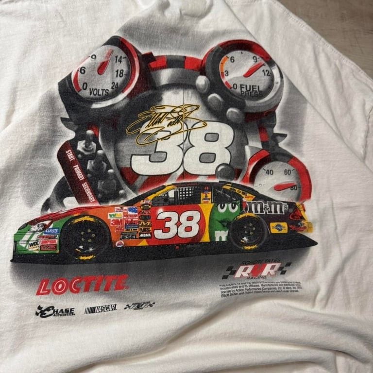 π₯ Vintage NASCAR 38 Racing Tee β Rare & Bold π₯
Rev up your style with this vintage 38 M&Mβs NASCAR tee featuring an iconic race car graphic and bold racing gauges on the back! This single-stitch, Y2K-era gem is perfect for motorsport lovers, s 3