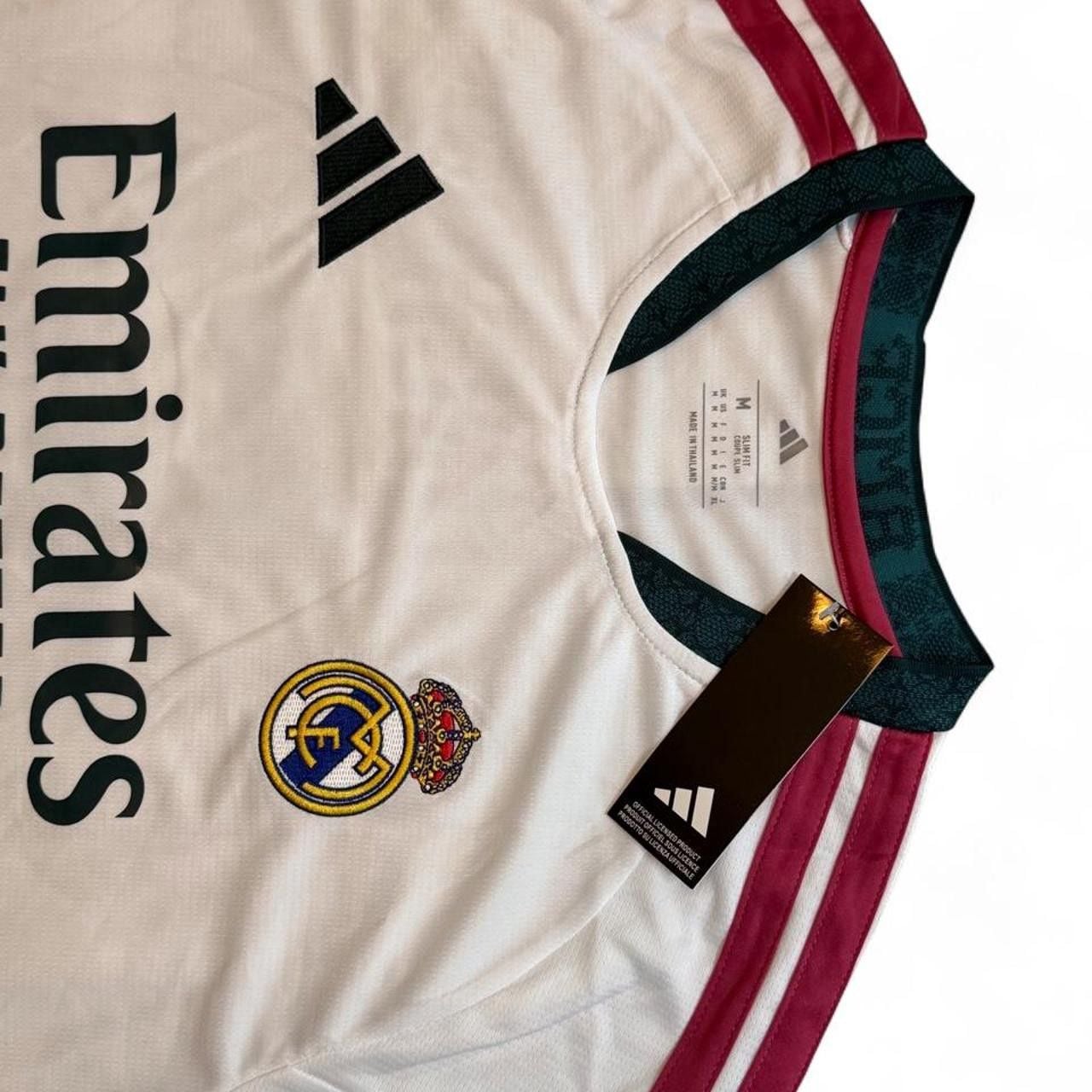 Adidas Real Madrid 2026/27 home shirt in white with maroon and dark green stripes on shoulders and sleeves, number 5 Bellingham on the back size Medium dimensions in the pictures brand new with tags. 7