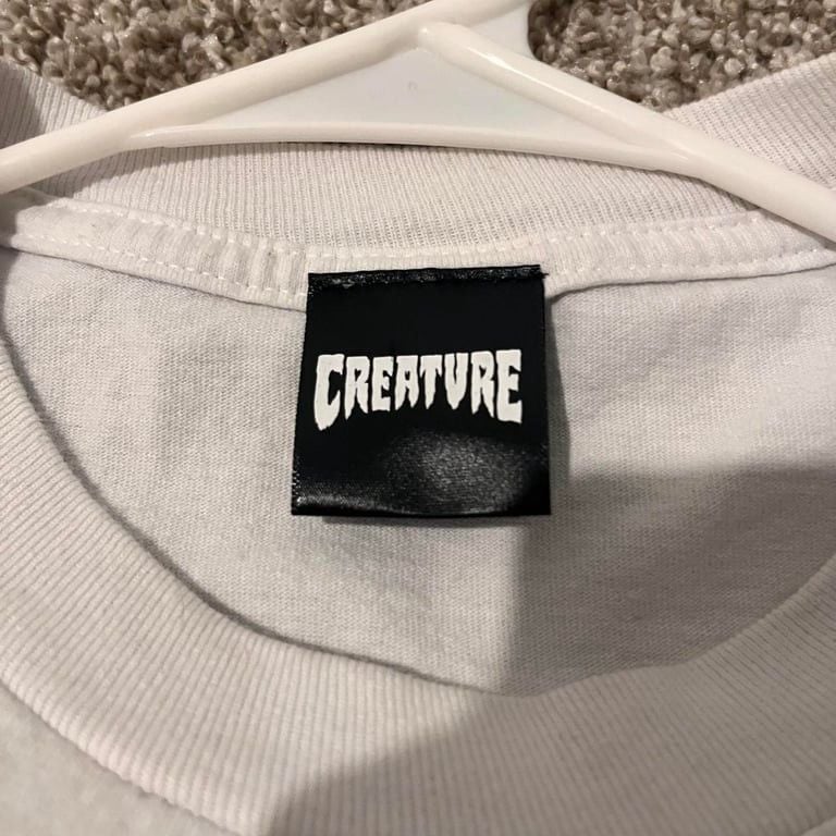 White and green Creature Skateboards tee 4