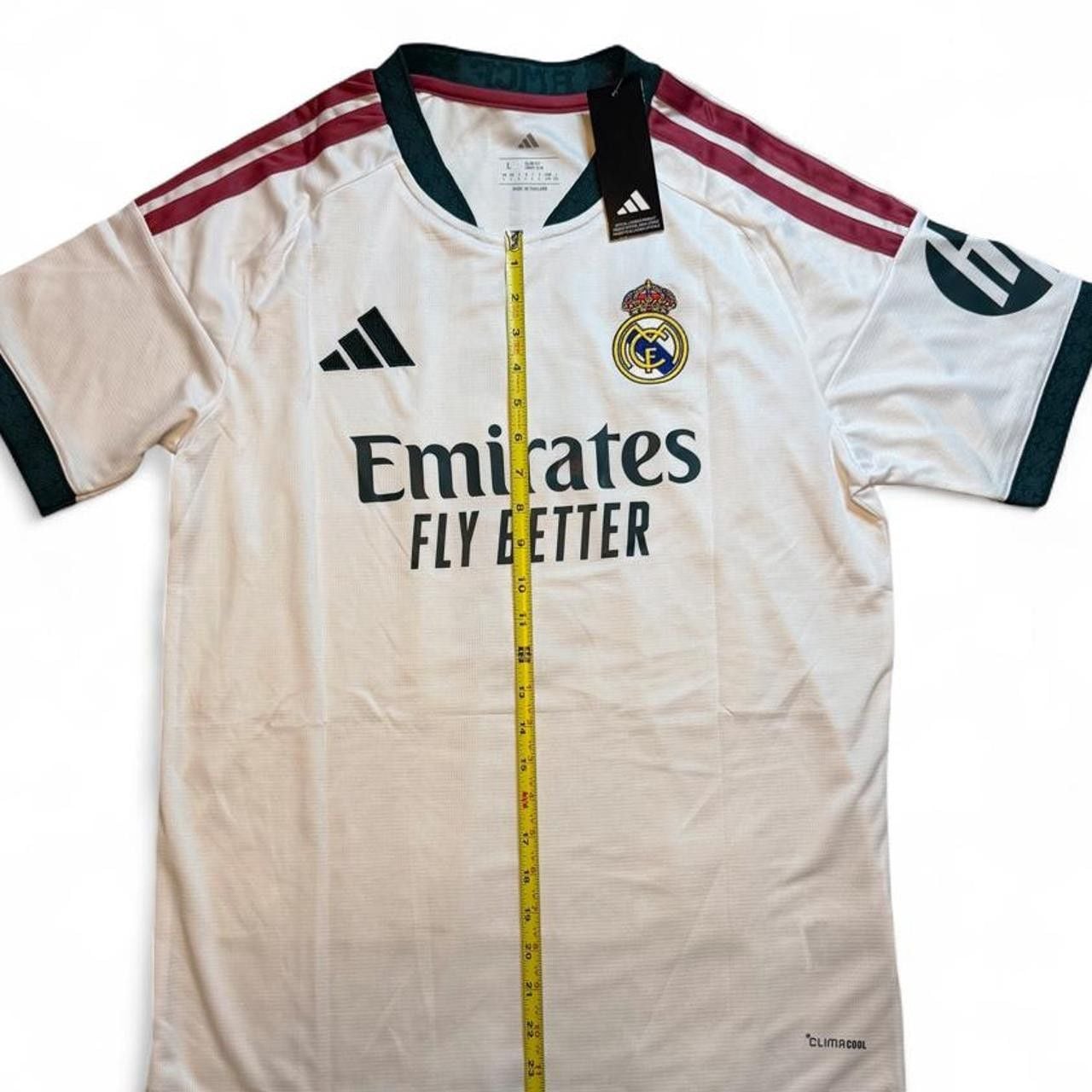 Adidas Real Madrid 2026/27 Home Jersey White with maroon and green stripes on shoulders and sleeves number 5 Bellingham on the back size Large dimensions in the pictures brand new with tags. 3