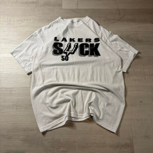 🔥 Vintage San Antonio Spurs “Lakers Suck” Tee – Large 🔥

A rare and bold throwback for die-hard Spurs fans! This vintage rivalry tee is a must-have for any collector or basketball enthusiast looking to rep their team with some classic sports 