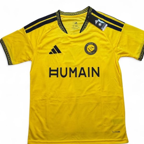 Adidas Al Nassr 2026/27 home jersey in yellow with black stripes on shoulders and black trim on collar and sleeves number 7 Ronaldo on the back size small dimensions are in the pictures brand new with tags.