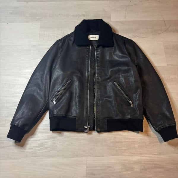 Black Mason Shearling-Collar Leather Bomber Jacket – XL

Step up your outerwear game with this sleek and rugged Black Mason leather bomber jacket. Crafted from genuine black leather, this timeless piece is built to turn heads and keep you warm in style