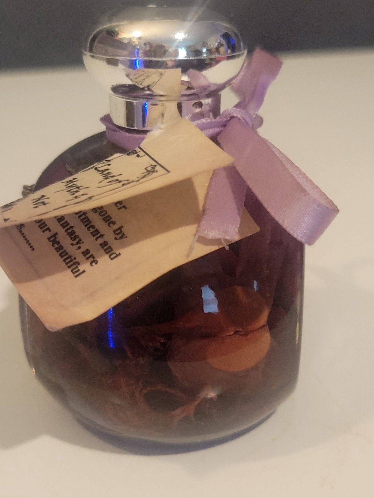 Land of Myth & Not" purple oil candle featuring a pewter fairy on a moon design. 7
