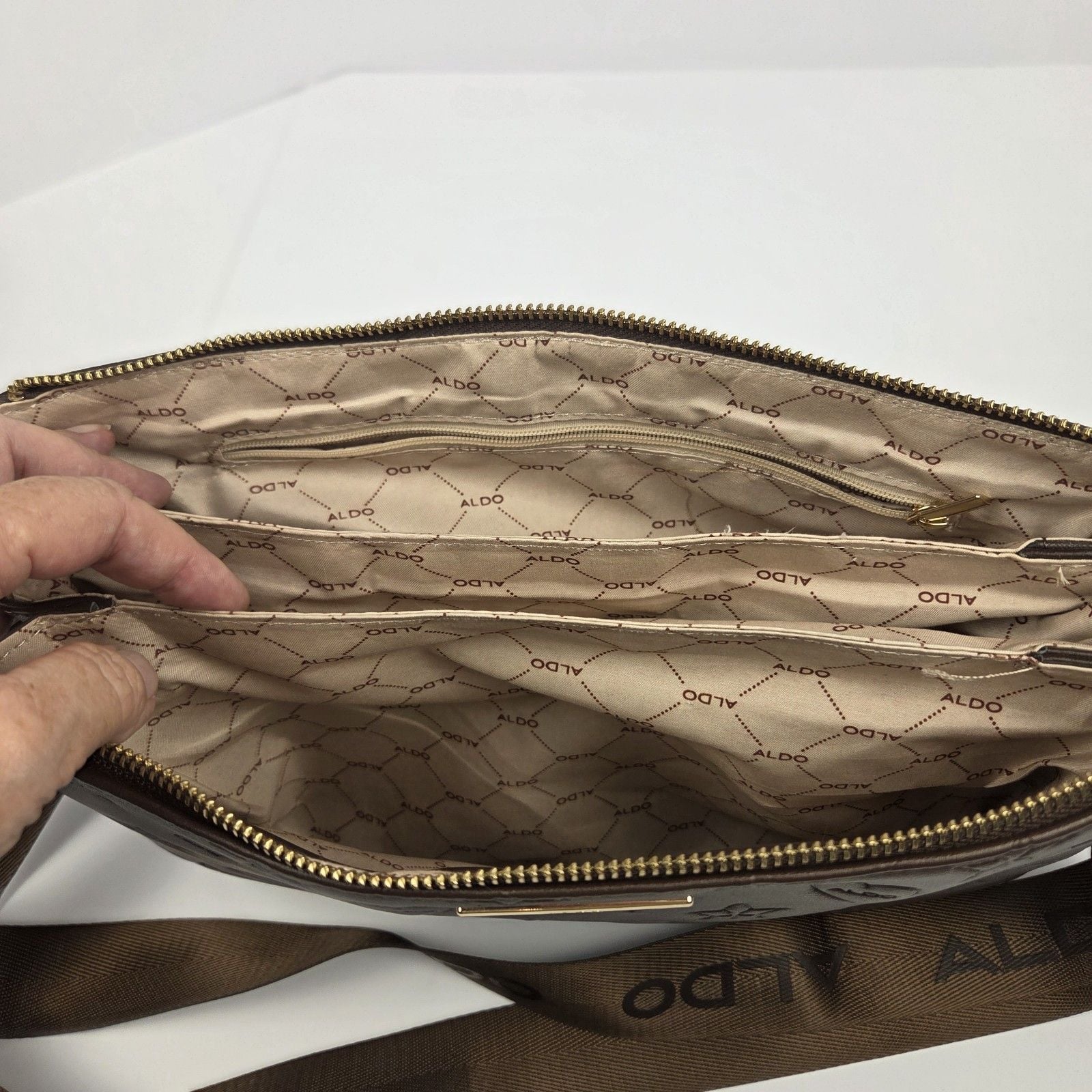ALDO Brown Embossed Logo Crossbody Bag Zip Closure Adjustable Strap Pockets 7