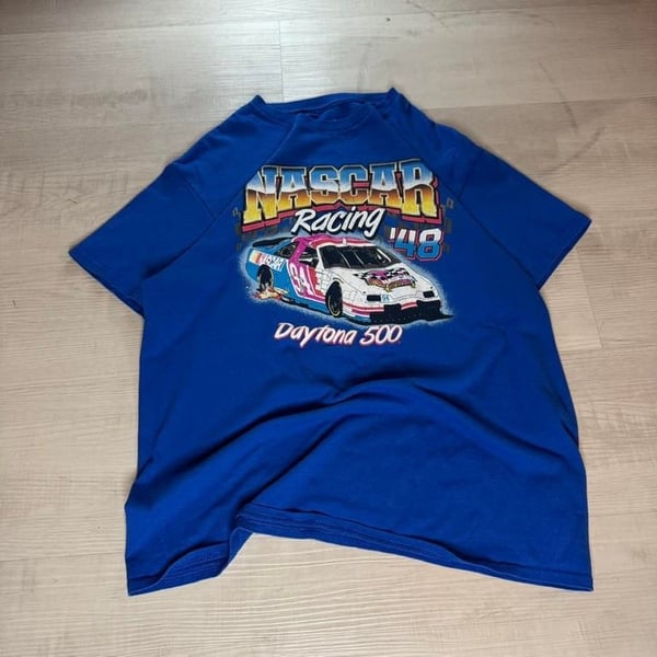 🏁🔥 Vintage NASCAR Racing 48 Tee – Daytona 500 Vibes! 🔥🏁

Get in the fast lane with this bold NASCAR Racing 48 Daytona 500 graphic tee! The perfect vintage piece for any racing fan, with an eye-catching front and back print featuring a speed