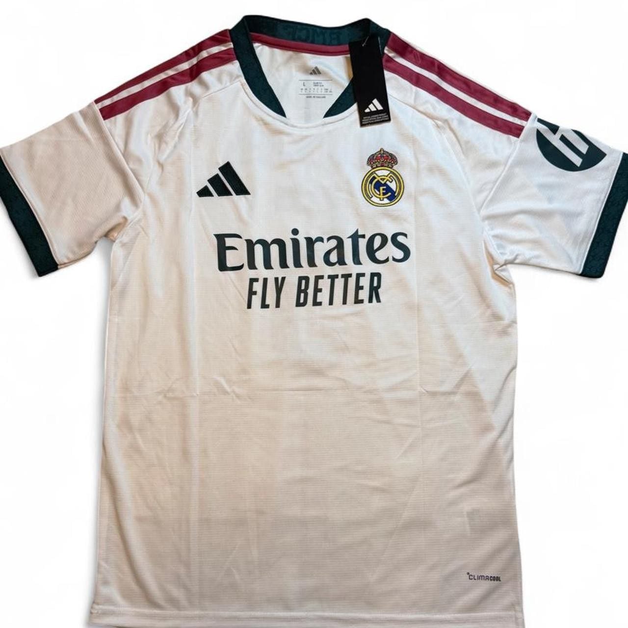 Adidas Real Madrid 2026/27 Home Jersey White with maroon and green stripes on shoulders and sleeves number 5 Bellingham on the back size Large dimensions in the pictures brand new with tags. 2