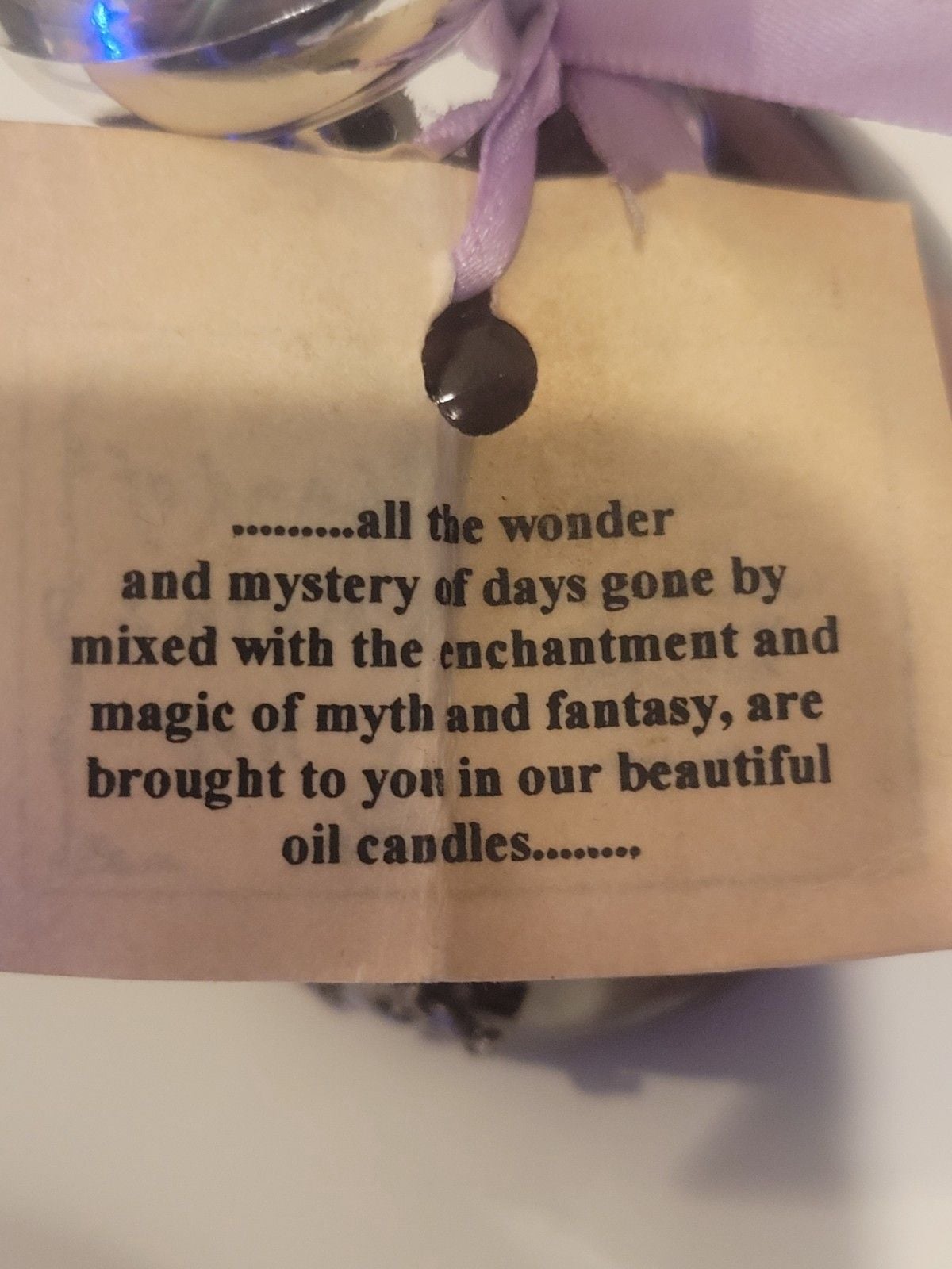 Land of Myth & Not" purple oil candle featuring a pewter fairy on a moon design. 9