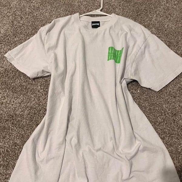 White and green Creature Skateboards tee
