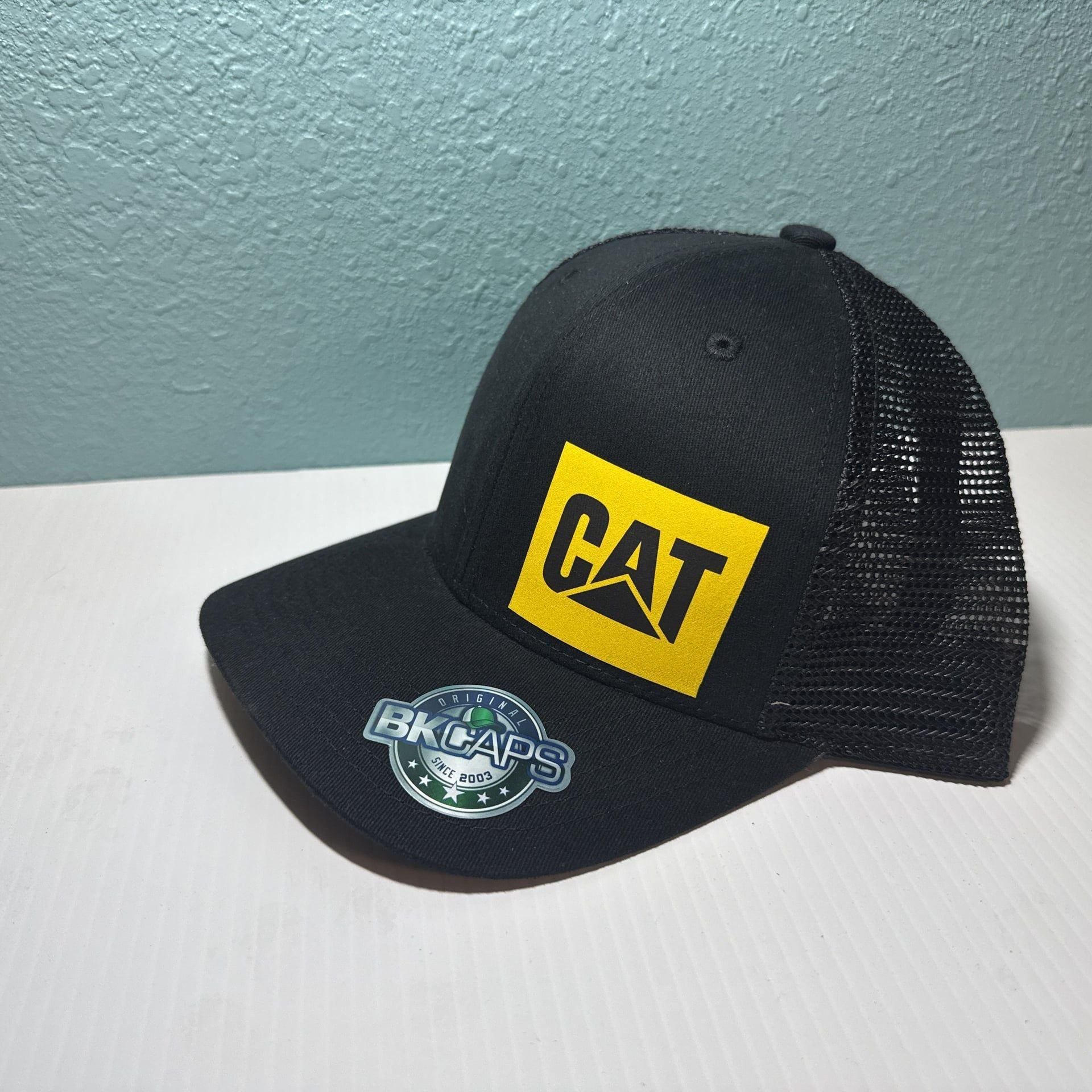 Caterpillar CAT BK Snap Back Trucker Hat 3