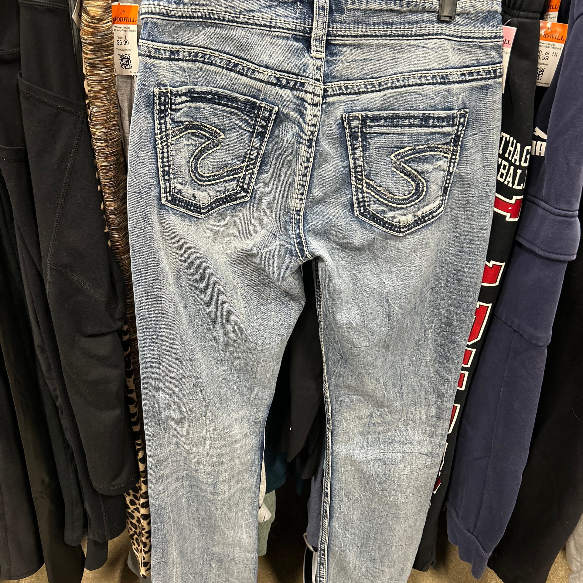Silver Jeans Co. Suki Mid-Rise Slim Bootcut Distressed Light Wash Jeans 1