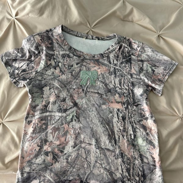 Mossy Oak Women's RealTree Camo Baby Tee with Sequin Bow Patch 
