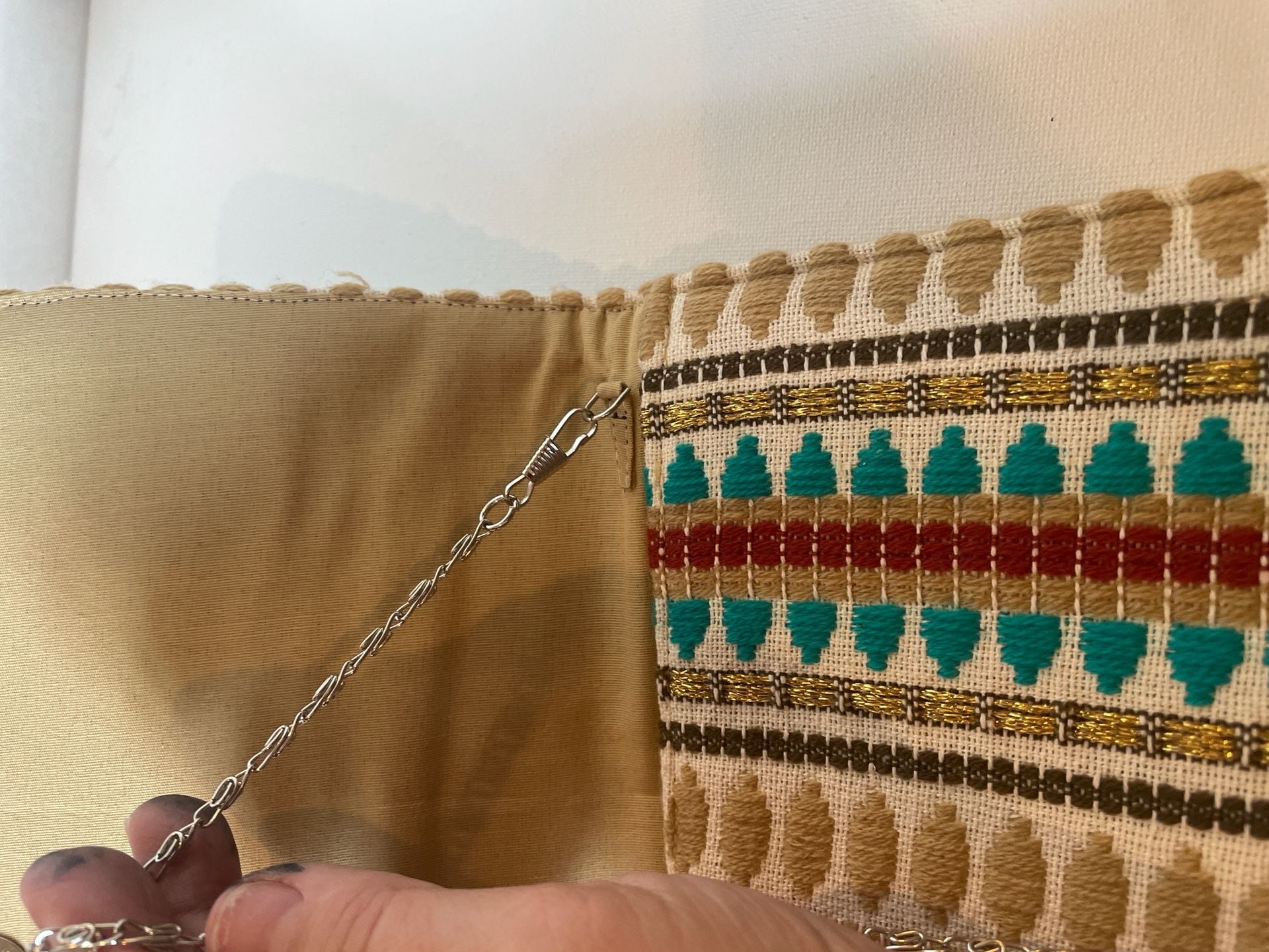 Charade Boho Embroidered Woven Clutch with Pom Poms and Chain Strap. 11