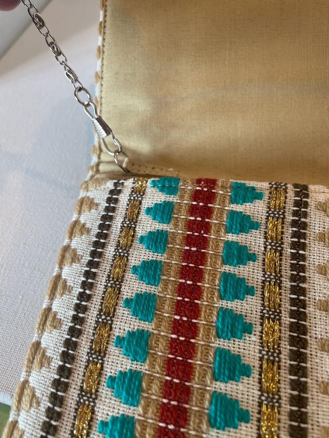 Charade Boho Embroidered Woven Clutch with Pom Poms and Chain Strap. 12