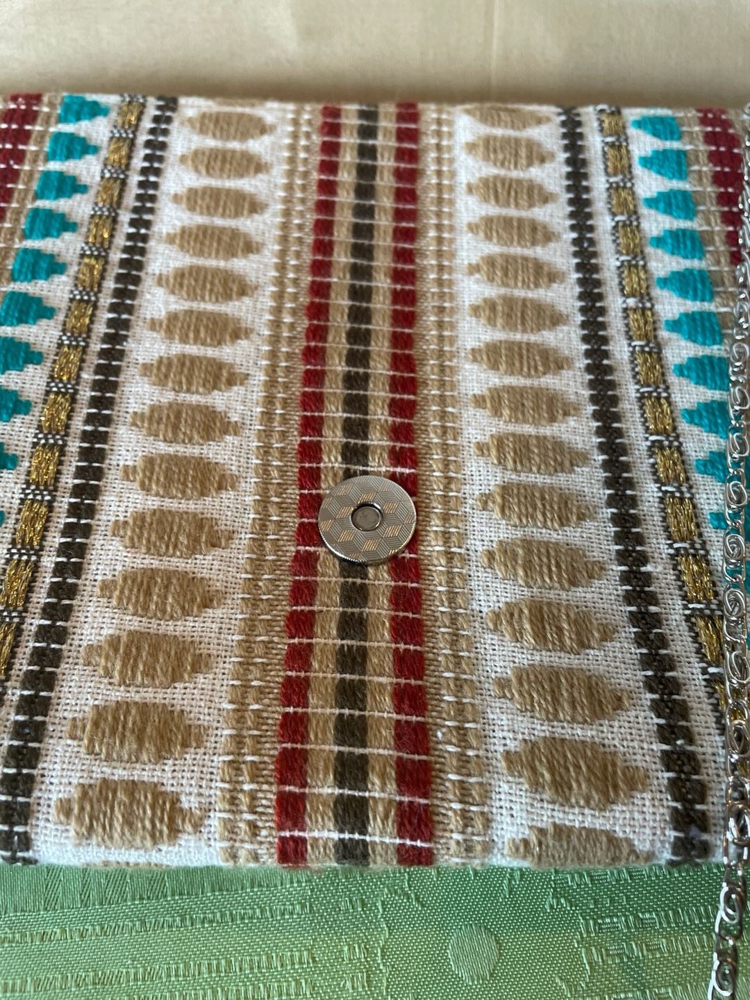 Charade Boho Embroidered Woven Clutch with Pom Poms and Chain Strap. 13