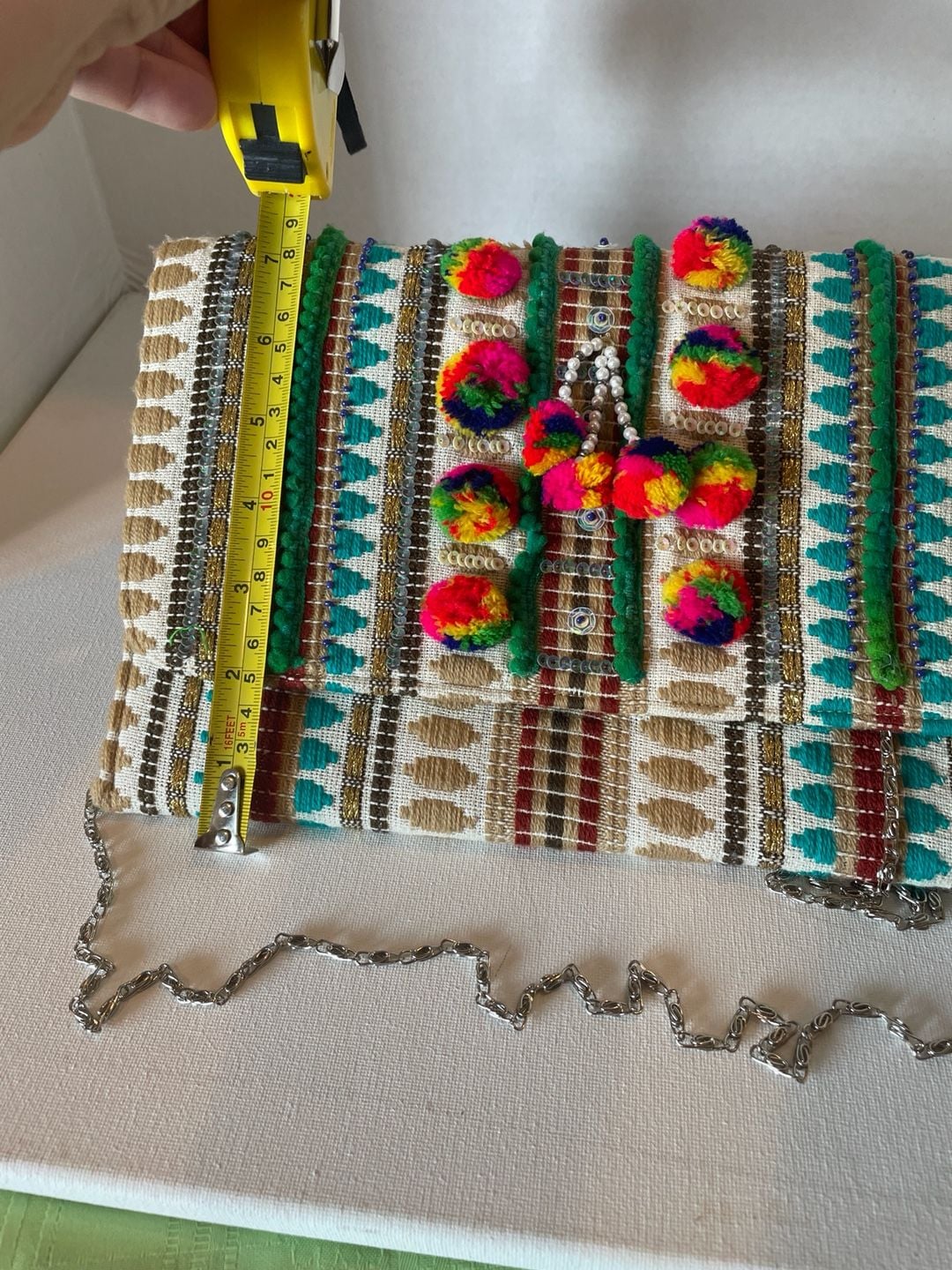 Charade Boho Embroidered Woven Clutch with Pom Poms and Chain Strap. 15