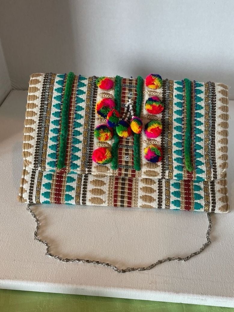 Charade Boho Embroidered Woven Clutch with Pom Poms and Chain Strap. 2