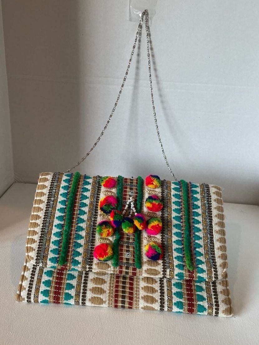 Charade Boho Embroidered Woven Clutch with Pom Poms and Chain Strap. 3