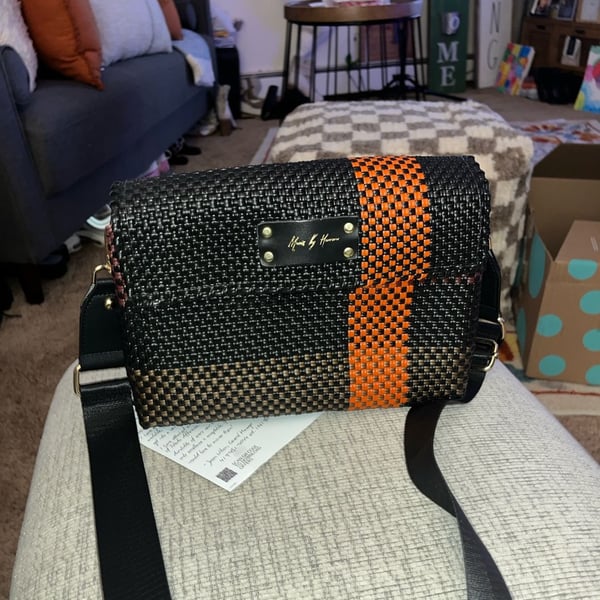 Maria by Herrera Woven Crossbody Bag Black and Orange Stripe