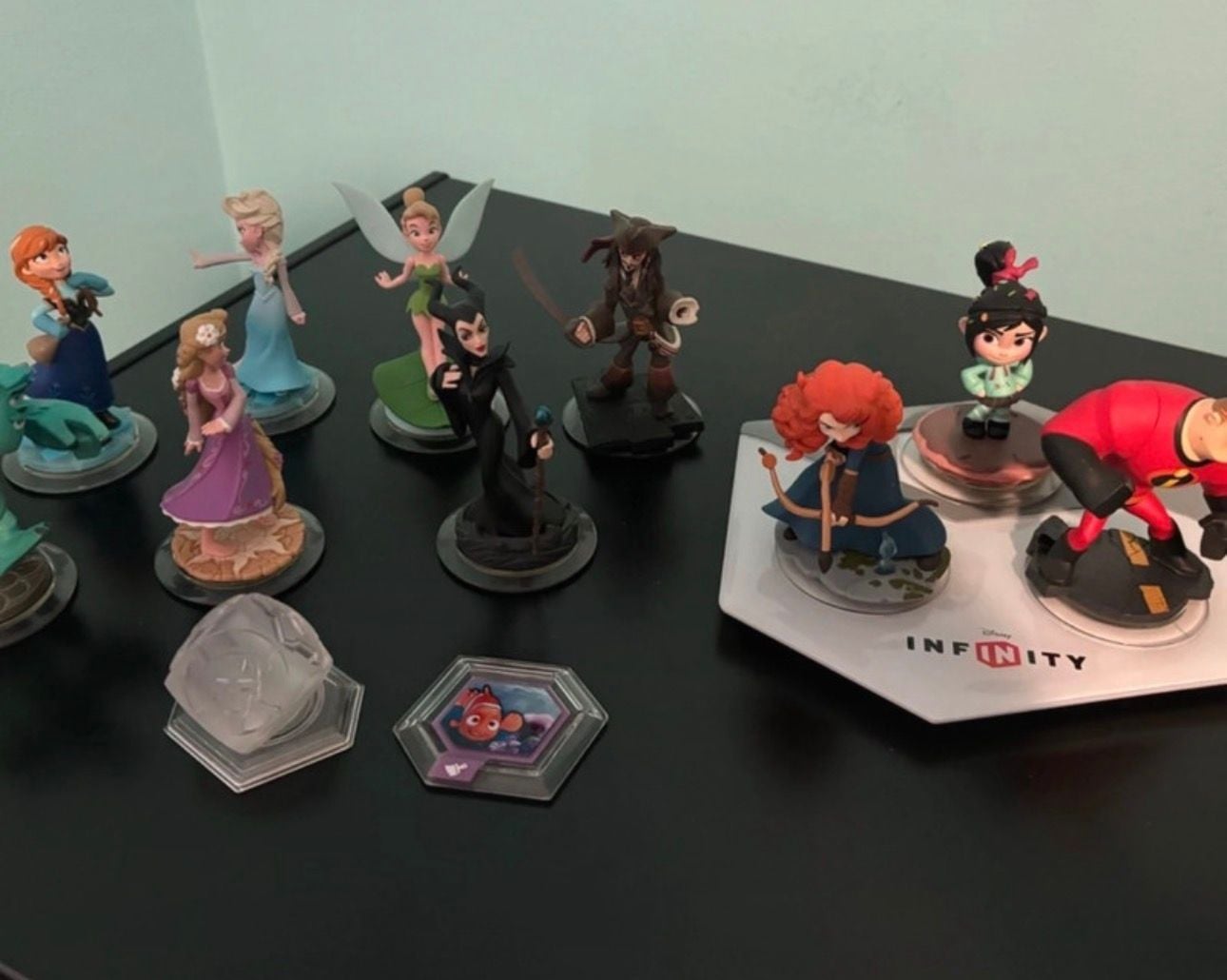 Disney Infinity Lot with Base, 10 Figures (Elsa, Anna, Jack Sparrow, Merida), Play Set Piece, and Power Disc and Disney game to play with characters in good condition 2