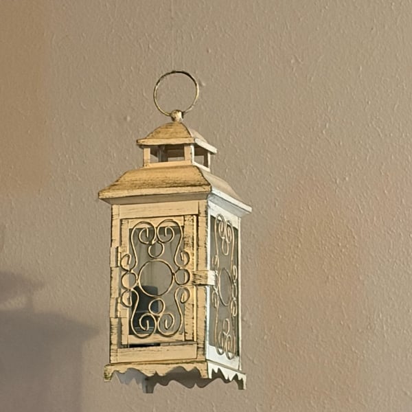Gallery of Light Distressed White Scrollwork Metal and Glass Candle Lantern
