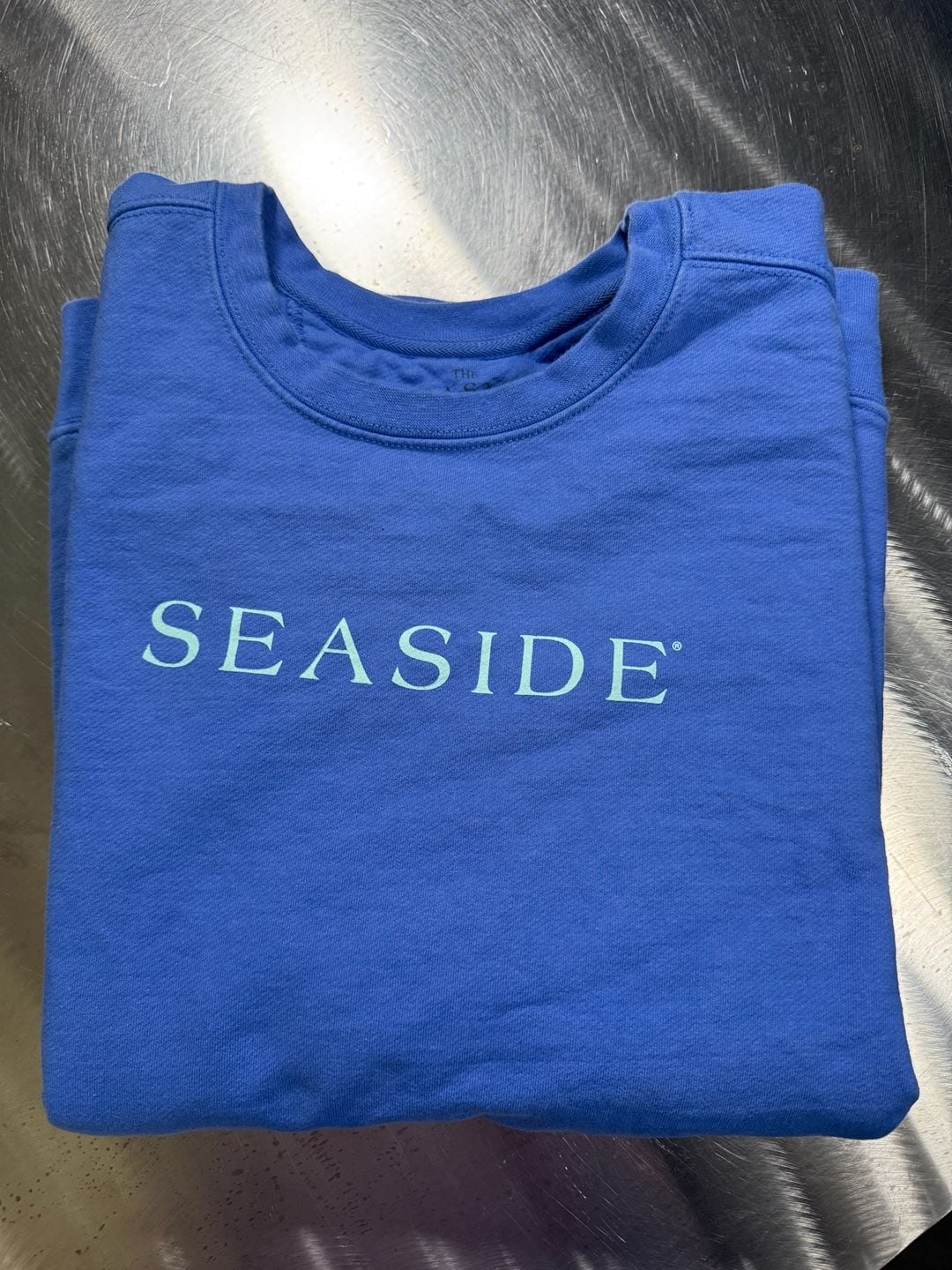 The Seaside Style Blue Crewneck Sweatshirt The New Town The Old Ways Graphic 2