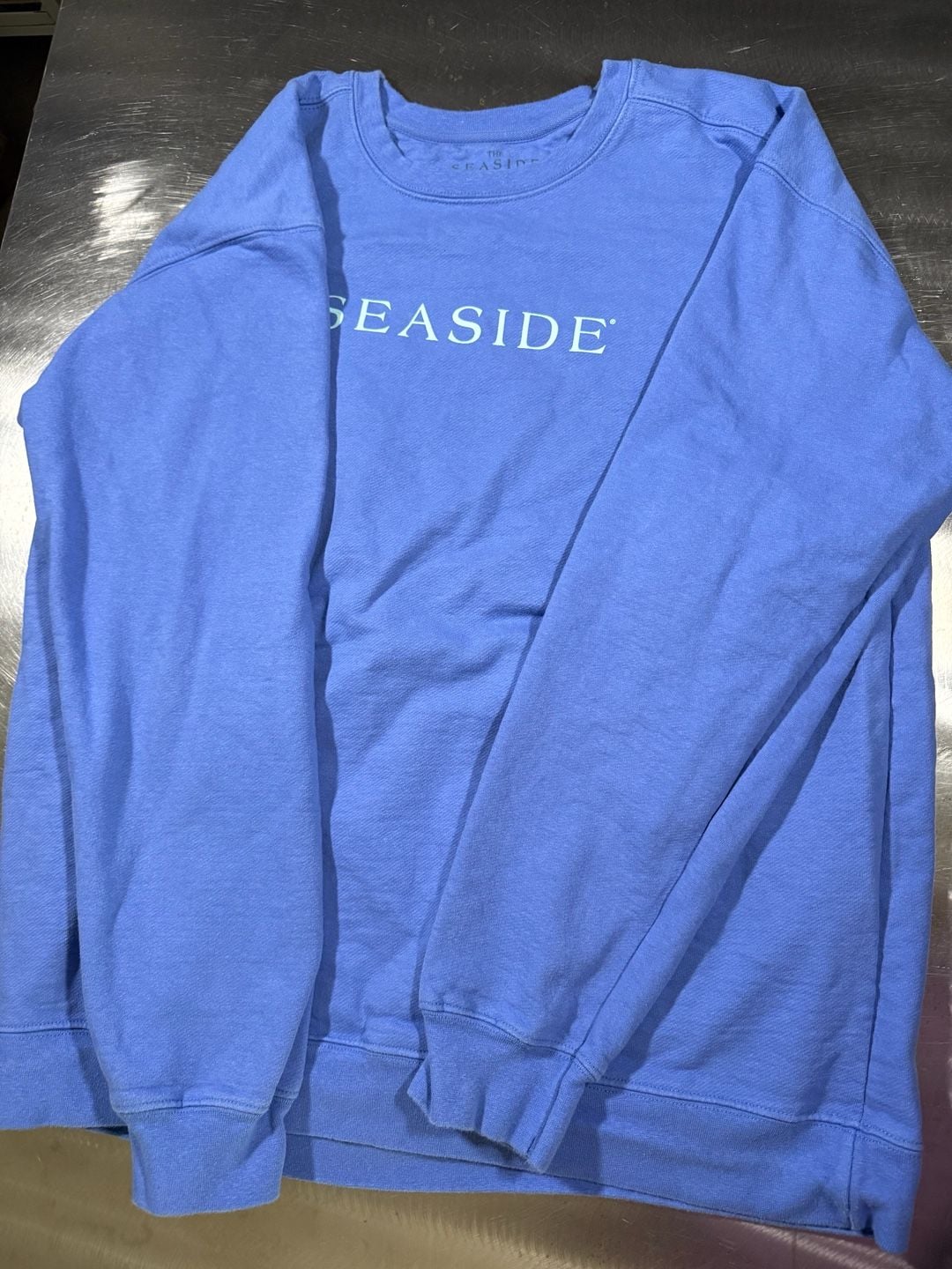 The Seaside Style Blue Crewneck Sweatshirt The New Town The Old Ways Graphic 3