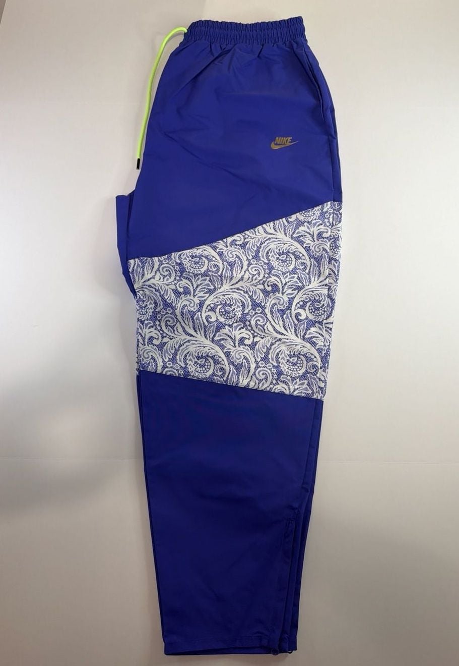 Nike Women's Sportswear Lapis Blue Paisley Lace Inset Track Pants DR6702-430 fit on men’s size Large. 3