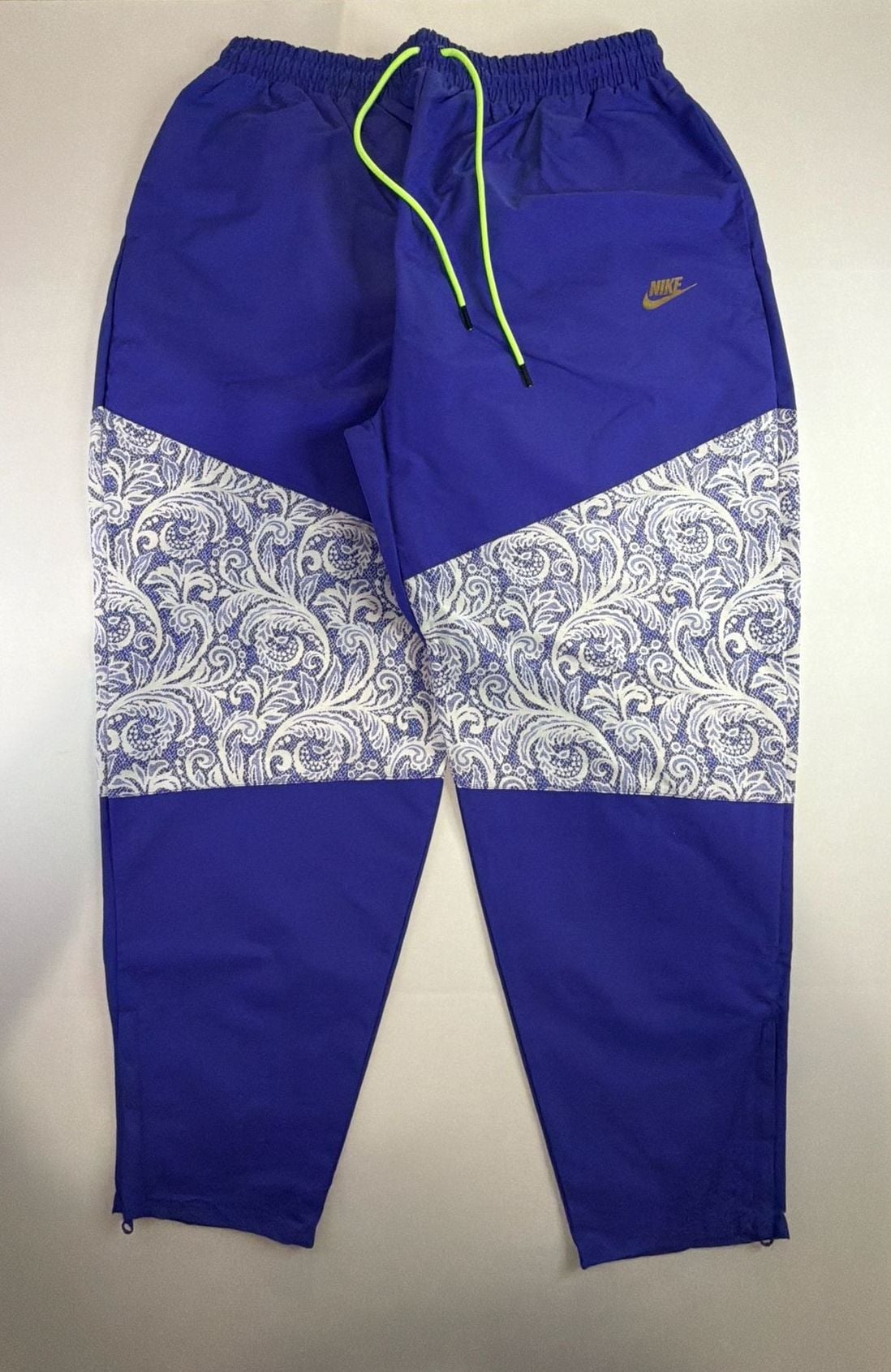 Nike Women's Sportswear Lapis Blue Paisley Lace Inset Track Pants DR6702-430 fit on men’s size Large. 2