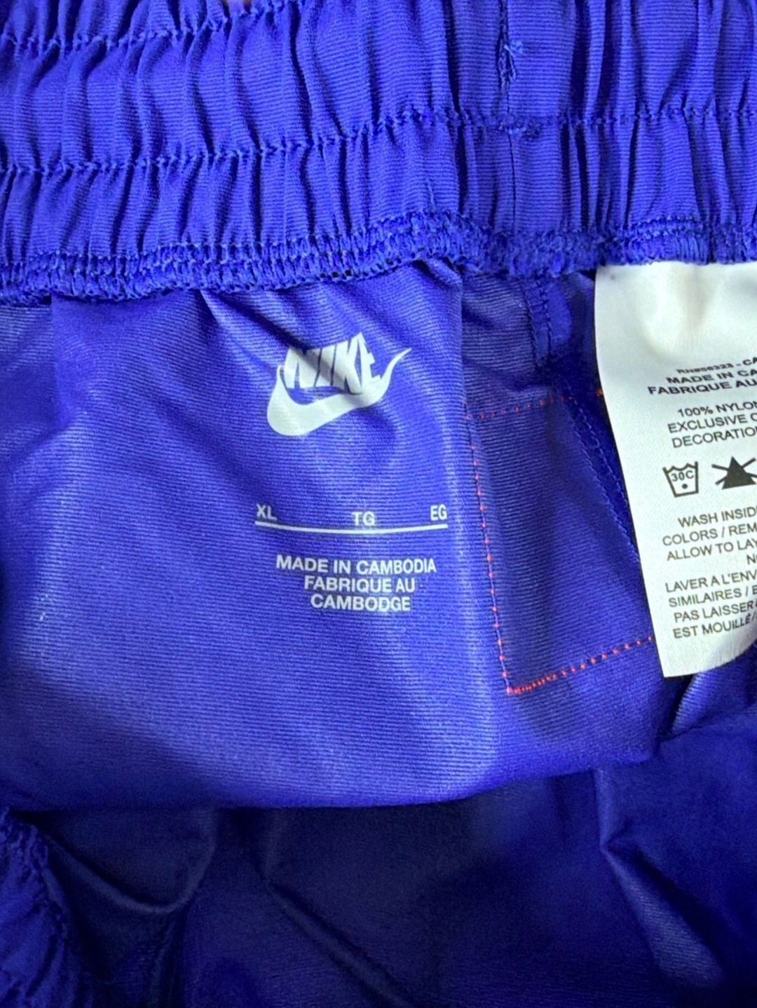 Nike Women's Sportswear Lapis Blue Paisley Lace Inset Track Pants DR6702-430 fit on men’s size Large. 9