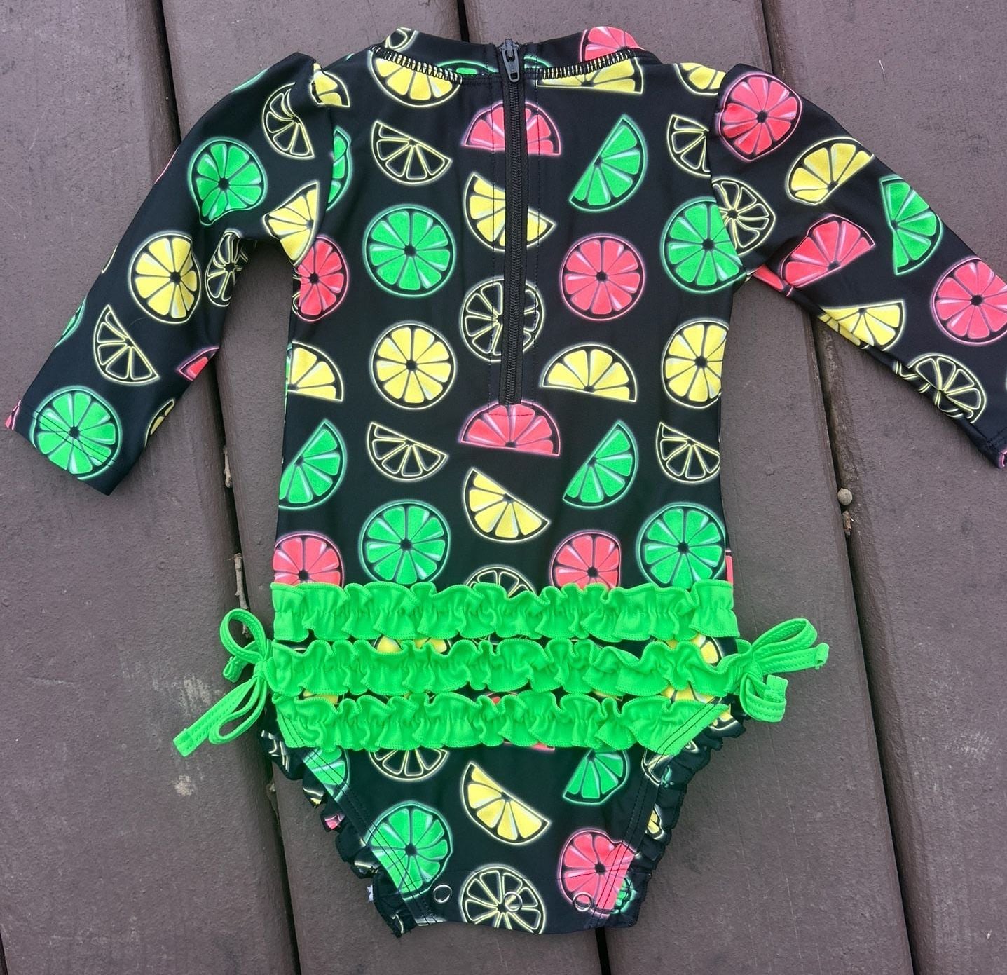 RuffleButts Neon Citrus Long Sleeve One-Piece Rash Guard Swimsuit 7
