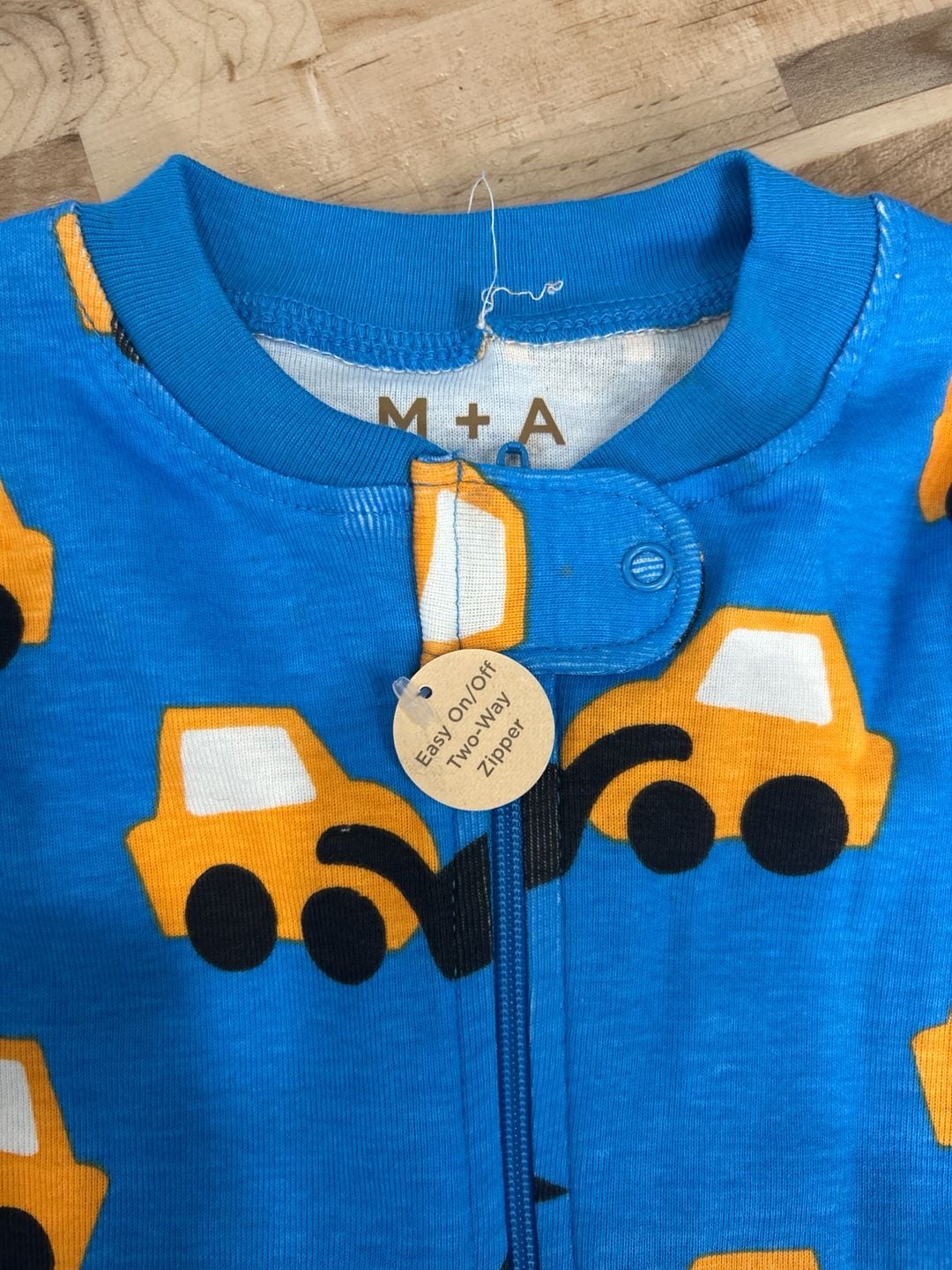 Monica + Andy Organic Cotton Two-Way Zip Romper in Construction Trucks 5