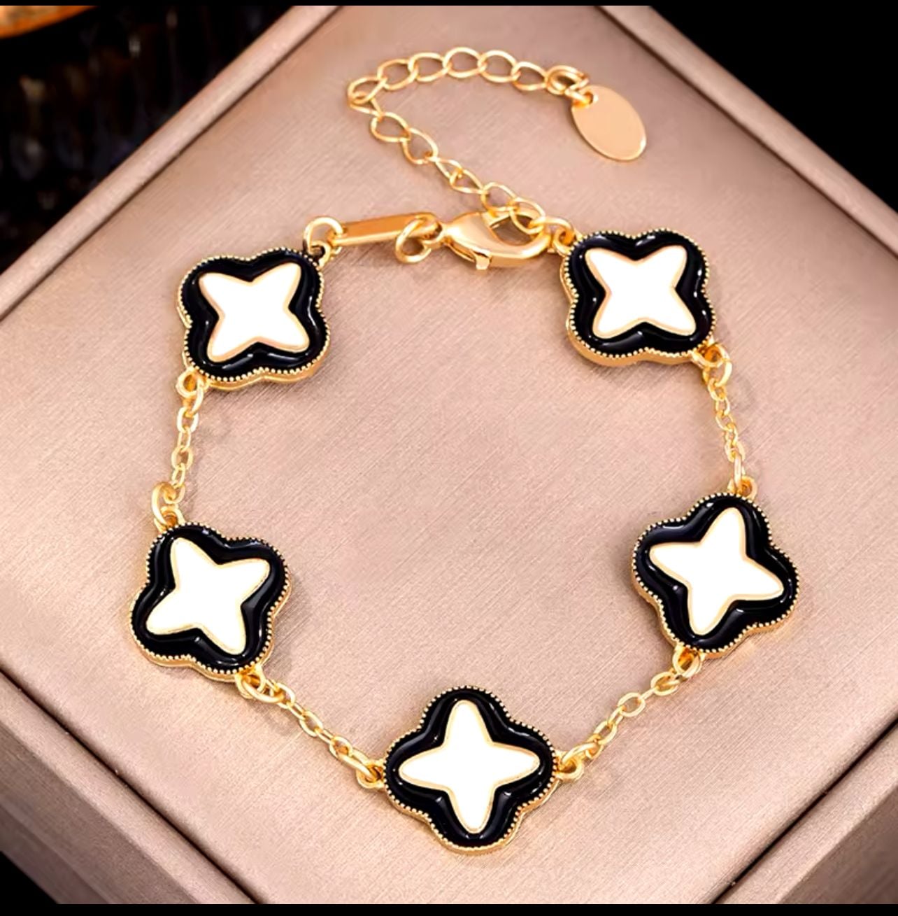 Gold-Tone Clover Motif Bracelet with Black and White Enamel 1