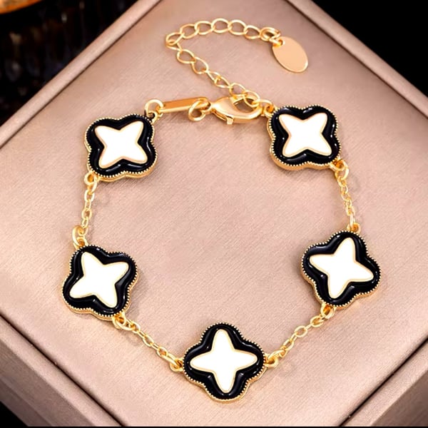 Gold-Tone Clover Motif Bracelet with Black and White Enamel