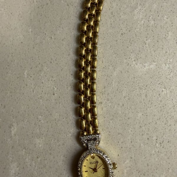 Elgin Women's Gold Tone Oval Quartz Watch with Rhinestone Bezel