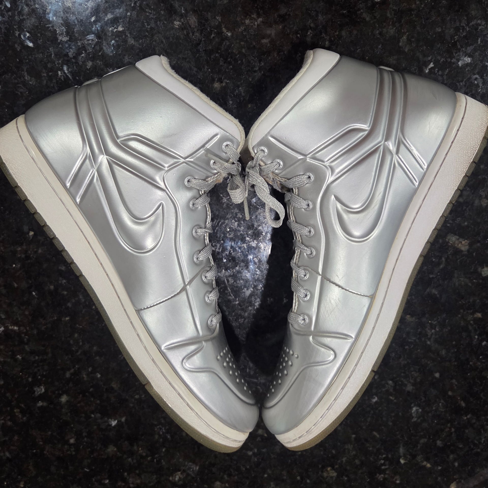 Iconic Air Jordan 1 Special Edition "Anodized Silver" Sneakers in Metallic Silver/Platinum. Men Size 10.

*$480 on novelship.com (see pic)* 9