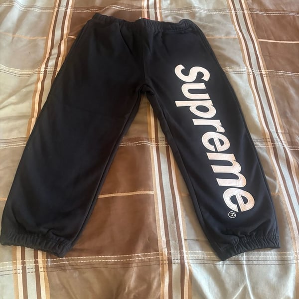 Black Supreme satin appliqué sweats