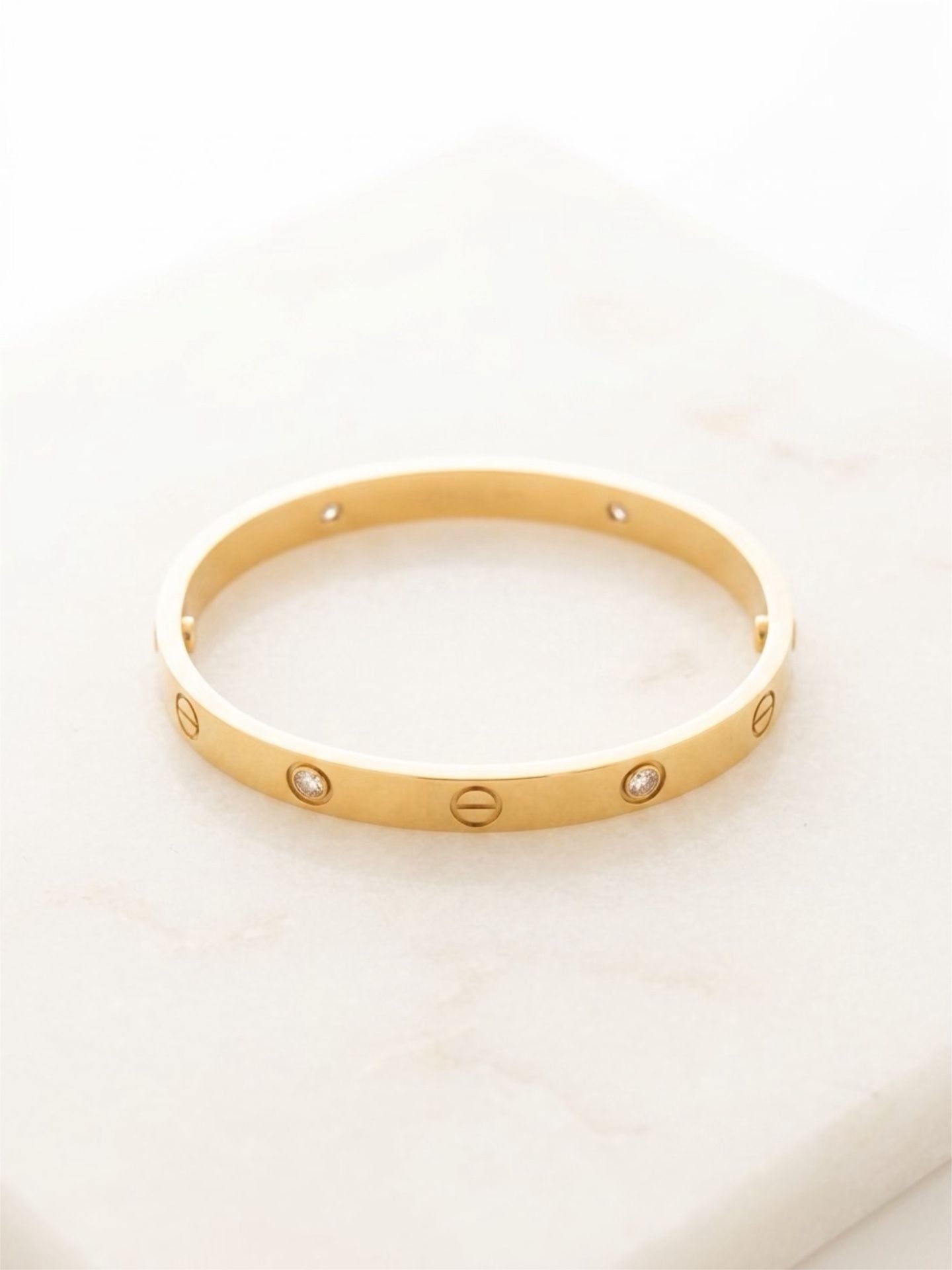 Trendy Fashion bangle with screw motif and 4 zircon stones. 2