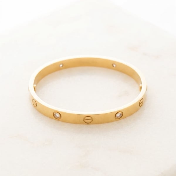 Trendy Fashion bangle with screw motif and 4 zircon stones.