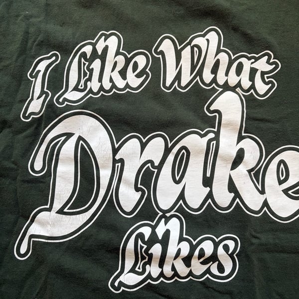 Drake It's All A Blur Tour 'I Like What Drake Likes' Green Graphic T-Shirt
Cracking on letters
