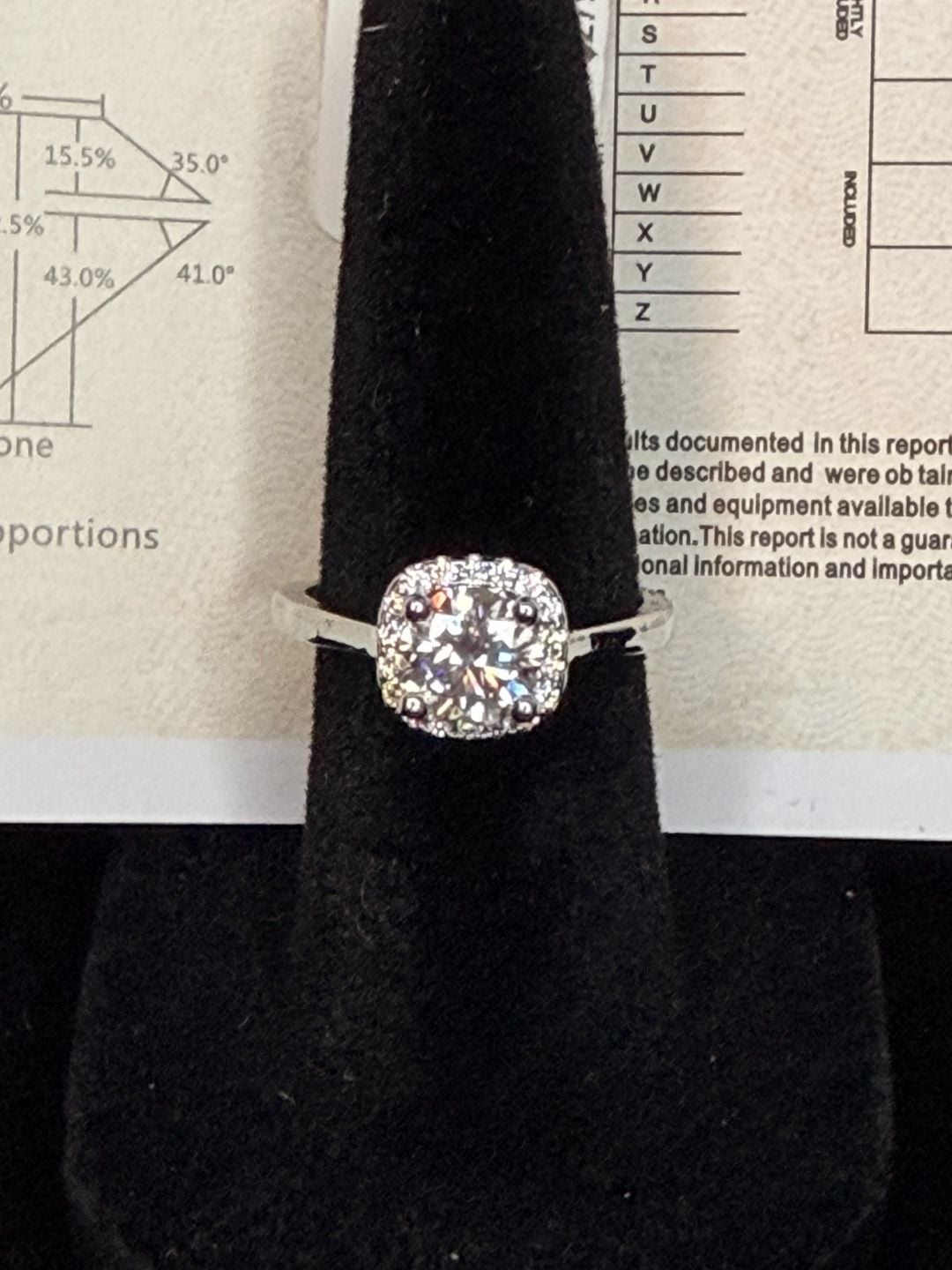 18K White Gold Plated Moissanite Halo Ring. Features a stunning 1.0ct 4